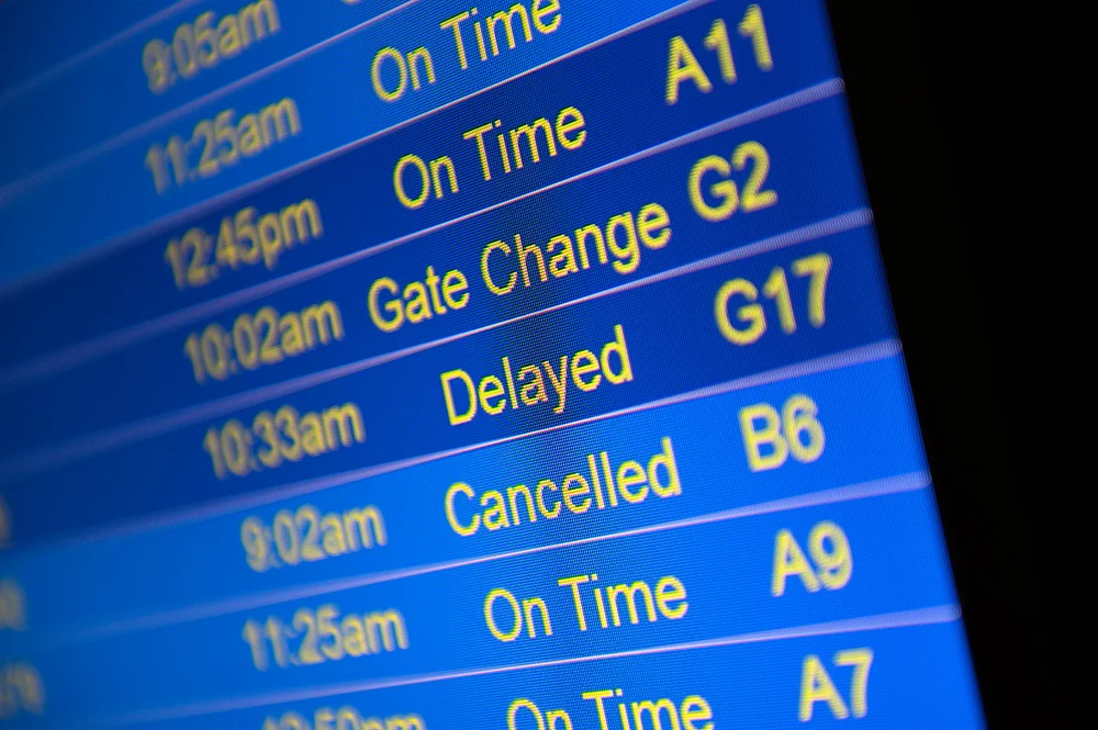 Computer screen showing that flights are delayed